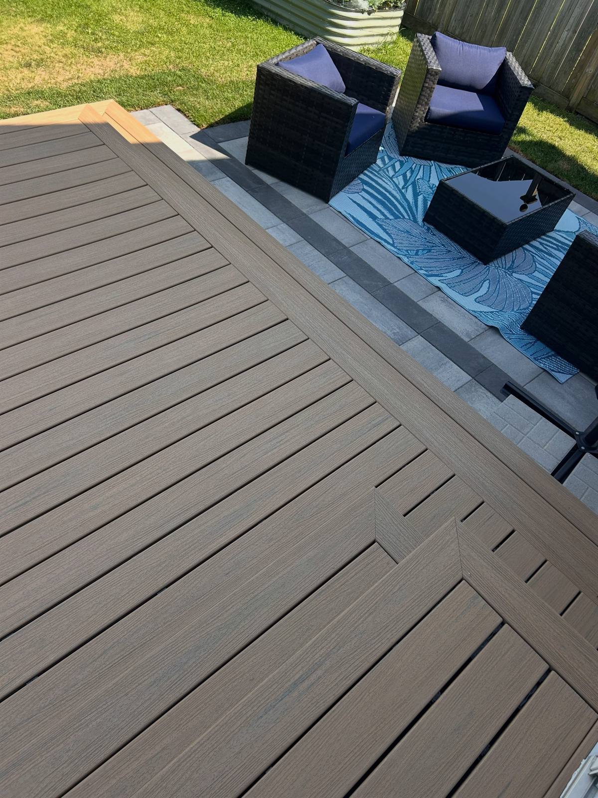 Low-maintenance deck and paver patio built by Gonzo Construction in the Kingston area