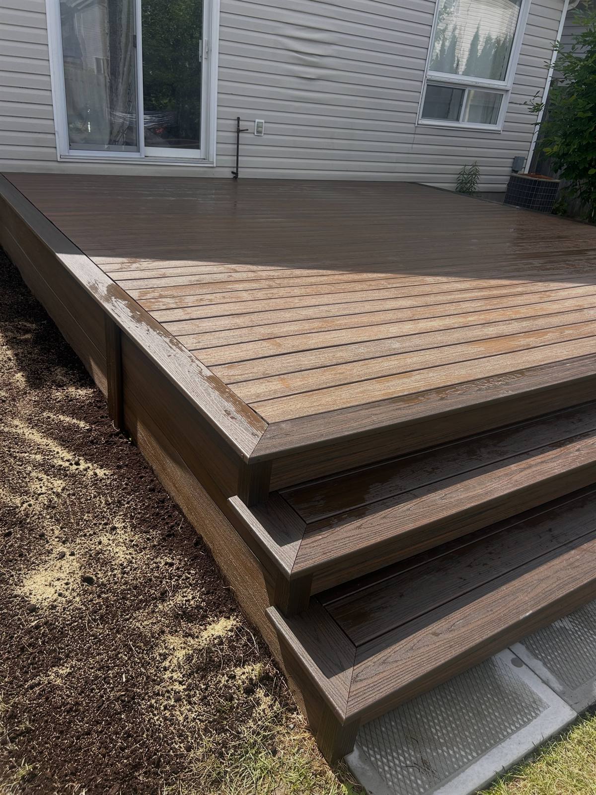 Low-maintenance deck with wide steps built by Gonzo Construction in the Kingston area
