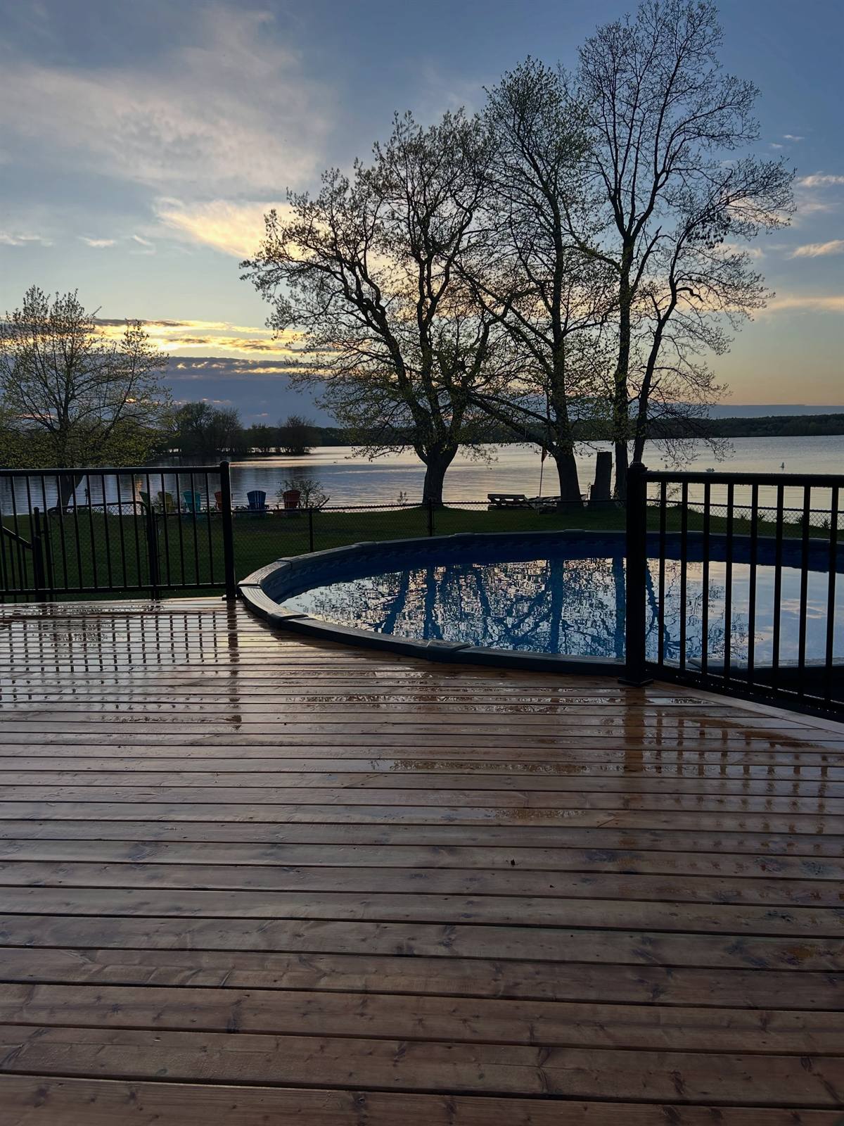 Lakeside deck at sunset built by Gonzo Construction in the Kingston area
