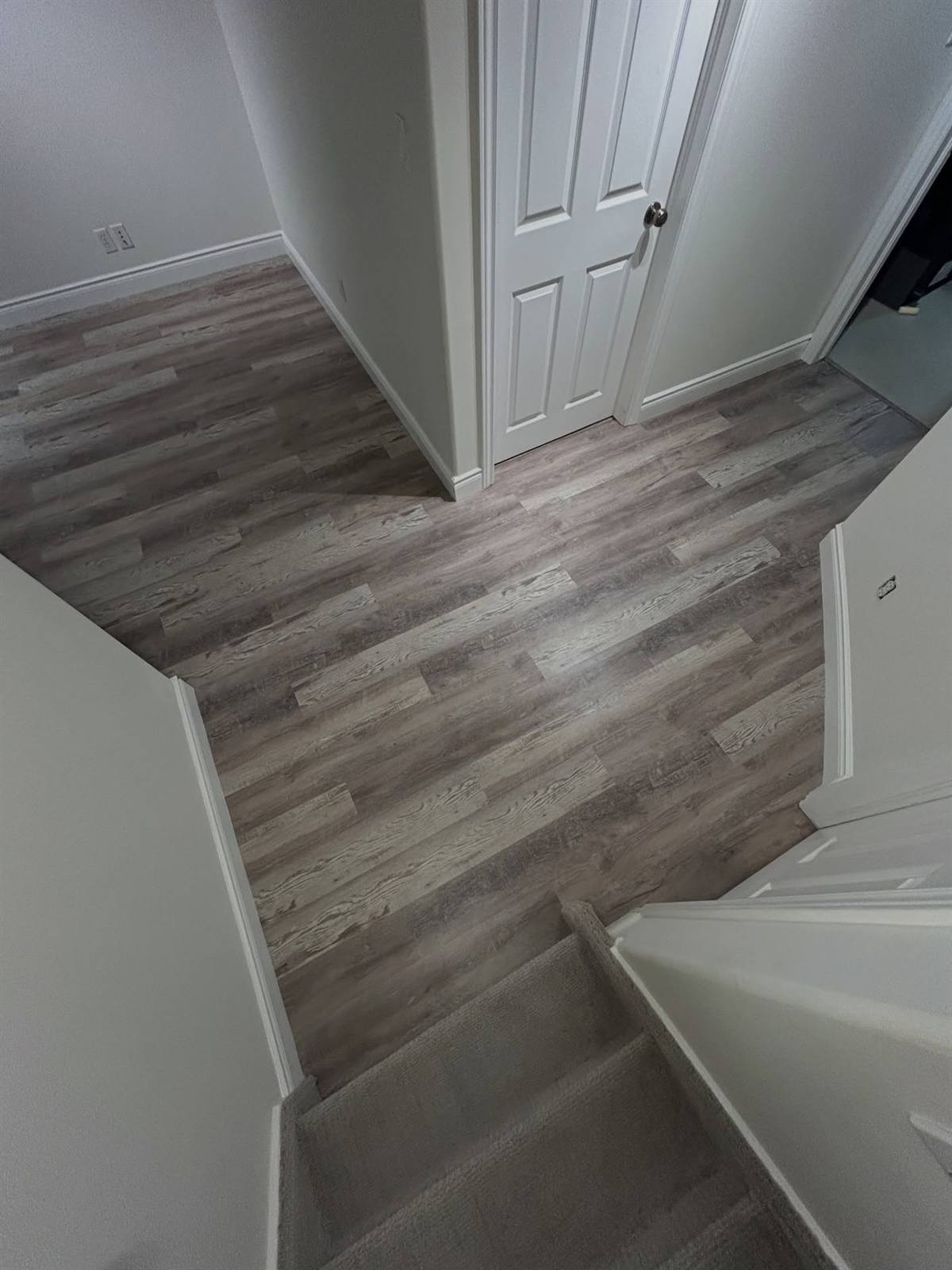 New vinyl plank flooring in a renovated basement in the Kingston area